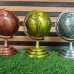 metallic tabletop world globes often marketed for home or office decor